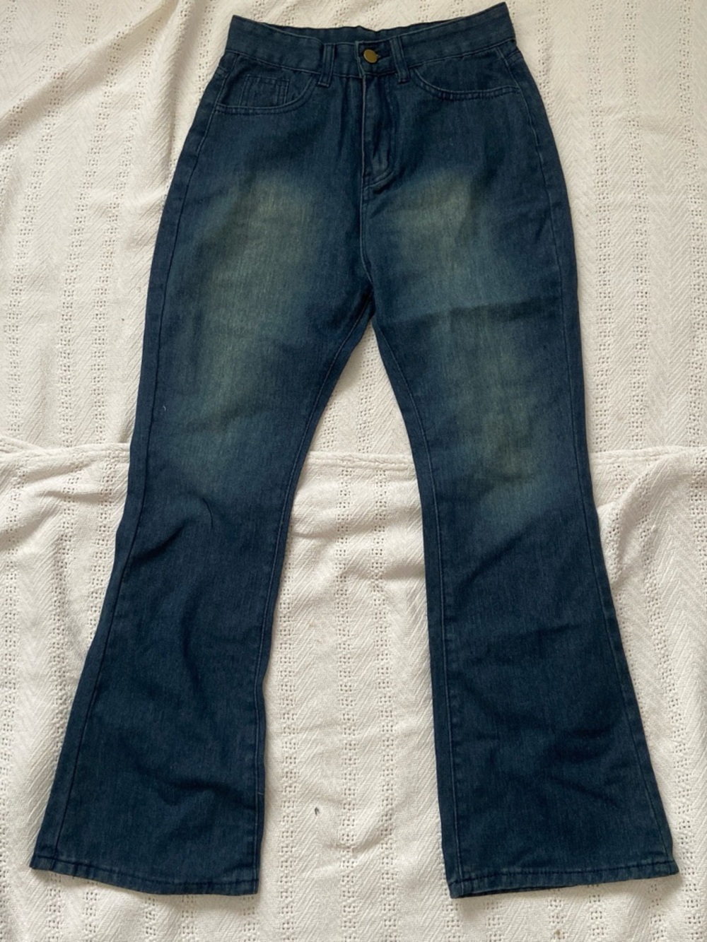 Mid Waist dark wash denim jeans with distressed look